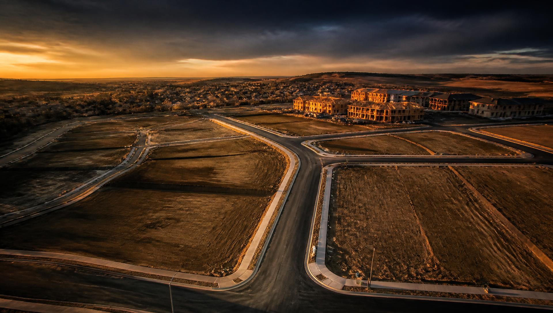 Aerial view of a residential land development at dusk